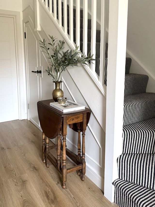 black and cream striped stair carpet on curved staircase